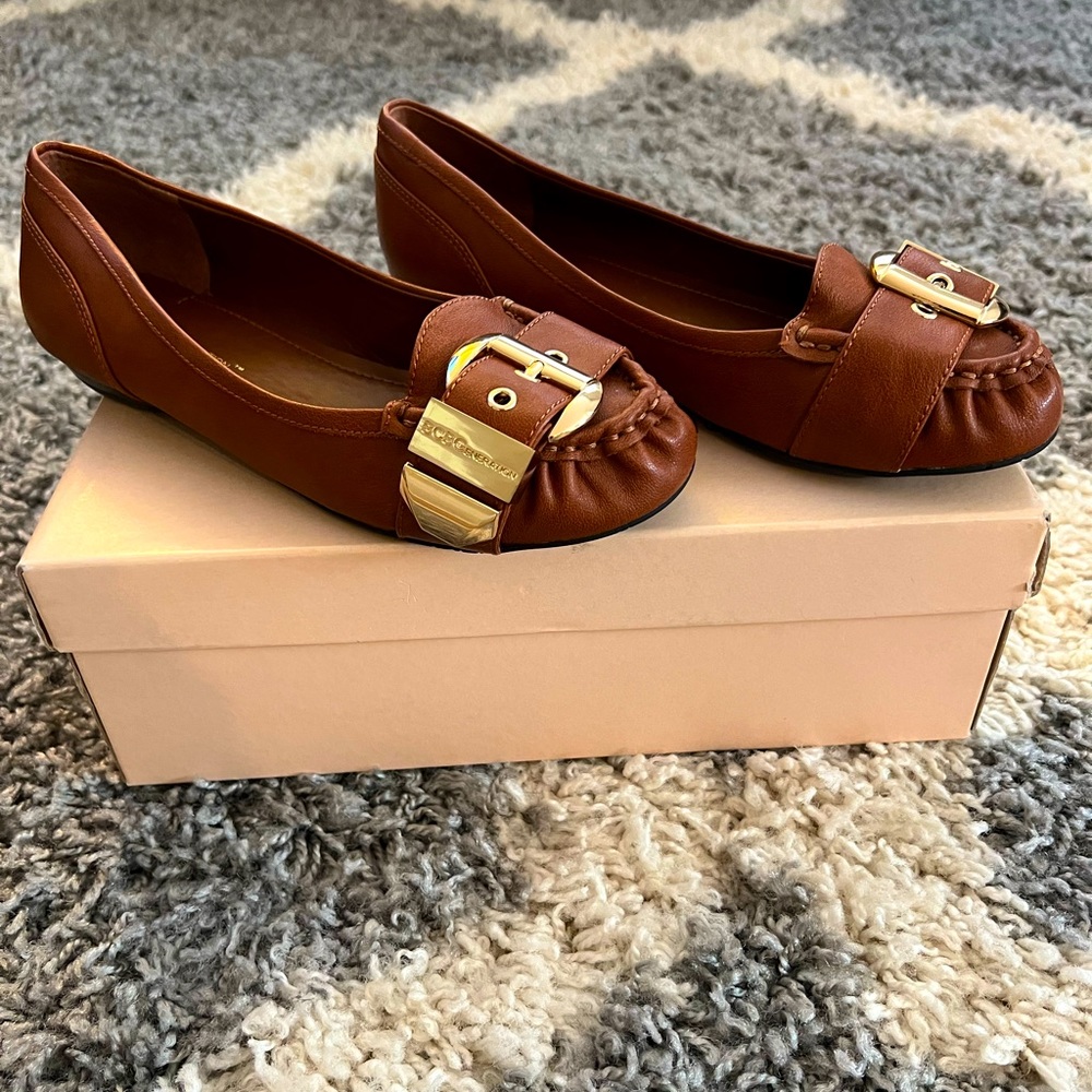 BCBG cognac flats with gold hardware
